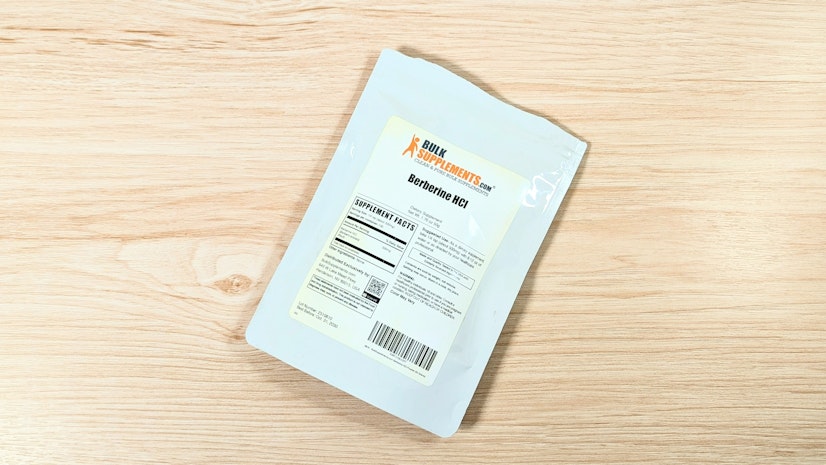 A bag of Bulk Supplements Berberine HCl on a wooden surface.