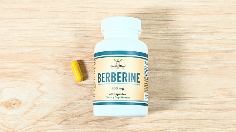 A bottle of Double Wood Berberine next to a one-capsule serving