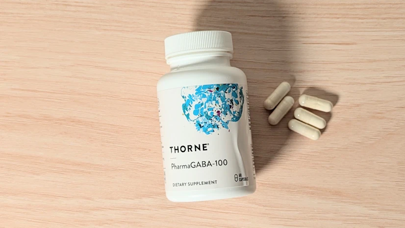 Thorne PharmaGABA-100 on a wood surface.