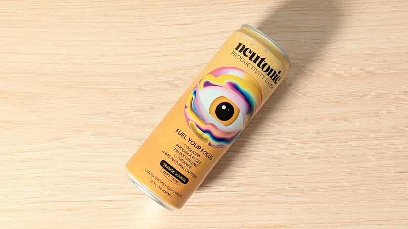 Neutonic Productivity Drink, Orange Sunrise flavor, on a wood surface.