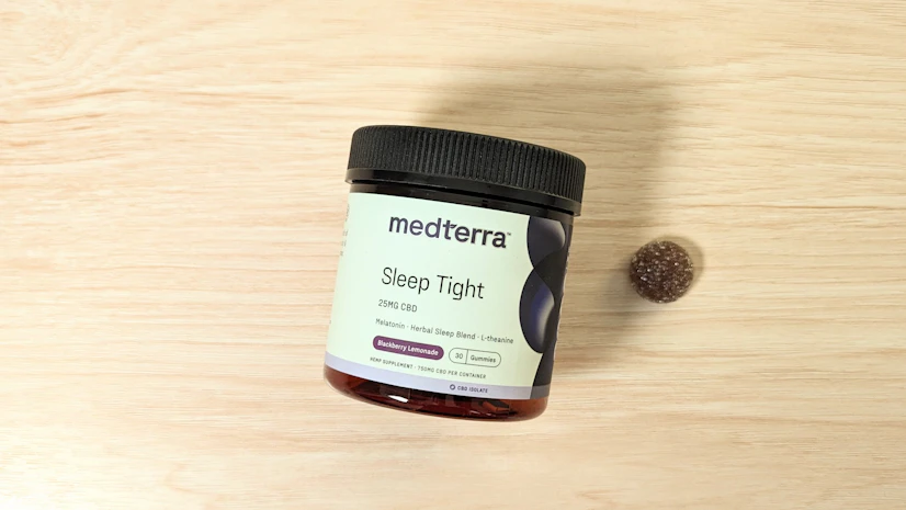 Medterra Sleep Tight Gummies on a wood surface.