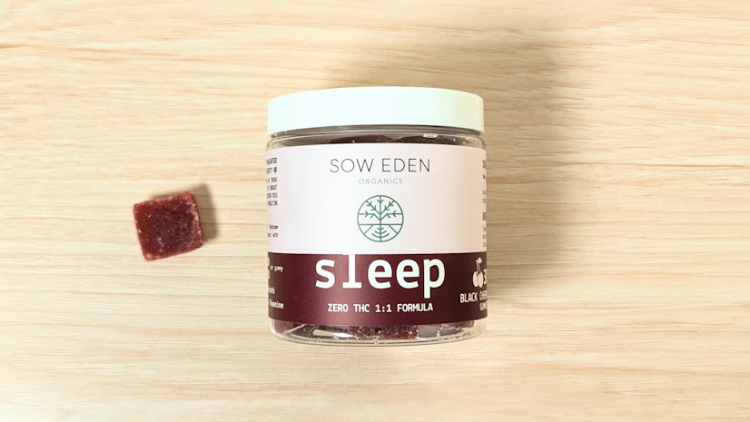 Sow Eden Sleep, Black Cherry flavor, on a wood surface.