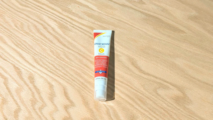 Overhead view of a tube of Vanicream Vitamin C Serum resting on a tabletop