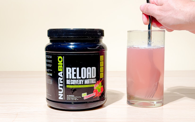 Nutrabio Reload mixed into a glass on a tan background