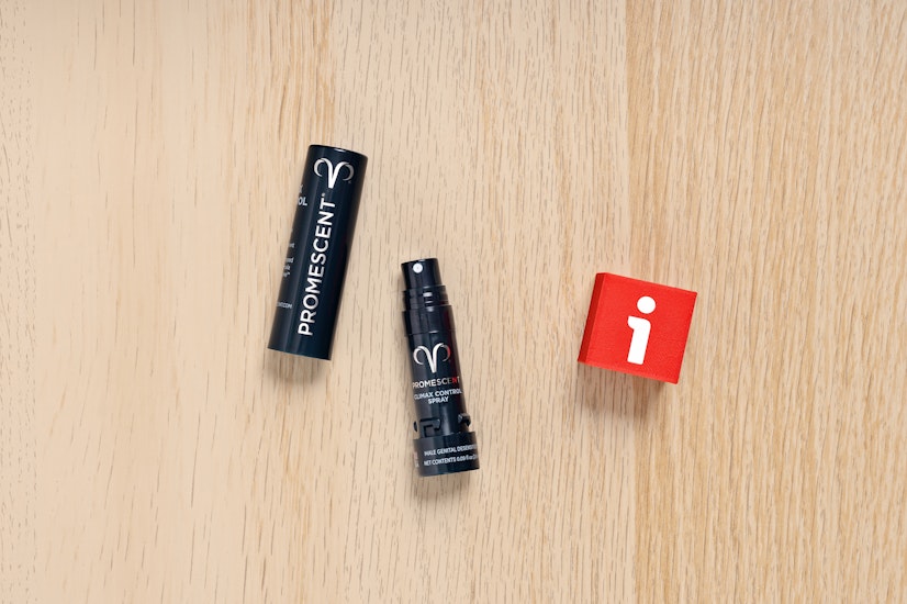 Promescent Climax Control Spray bottle with cap removed, shown on wood surface – top-rated delay spray for premature ejaculation