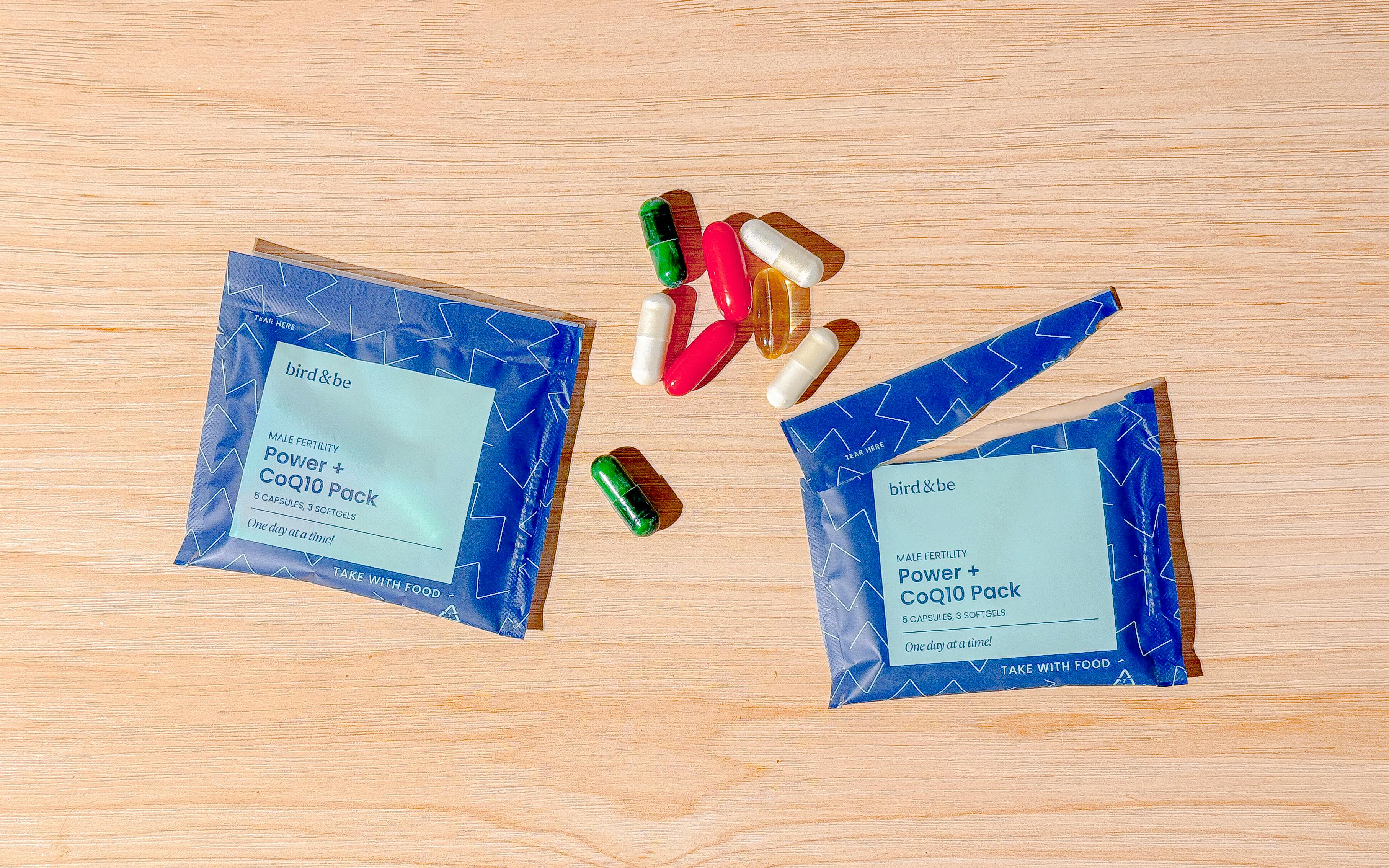 Bird & Be Male Fertility Power Pack - packets and capsules on a wood countertop