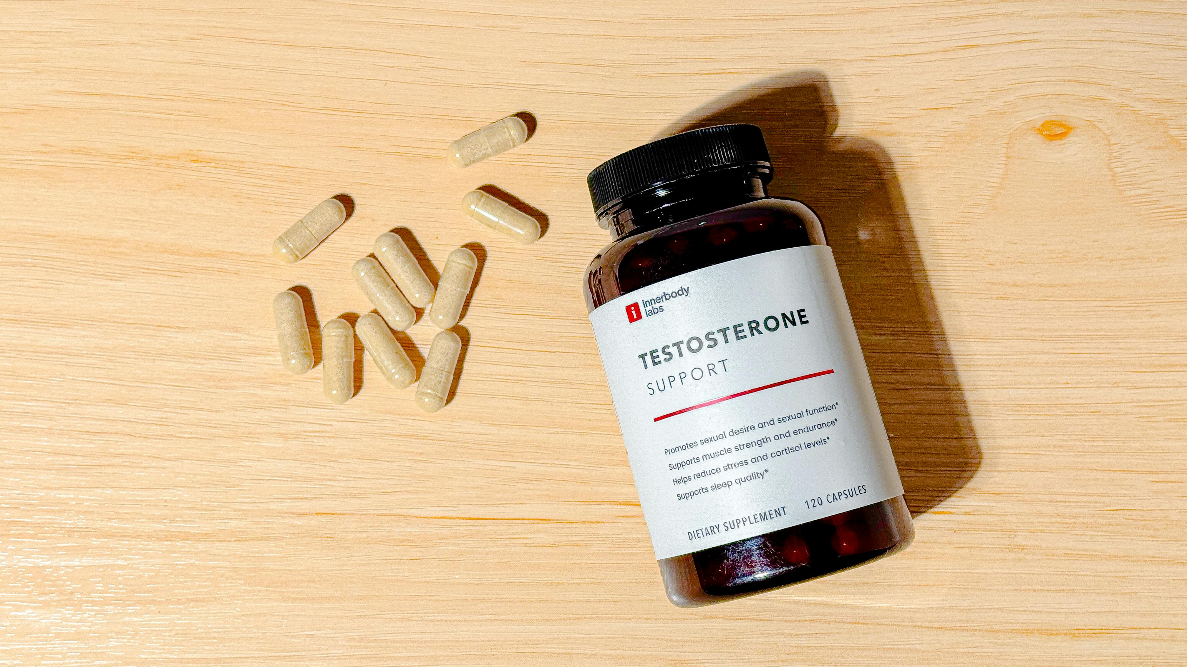 Testosterone Support by Innerbody Labs - container and capsules on a wood countertop