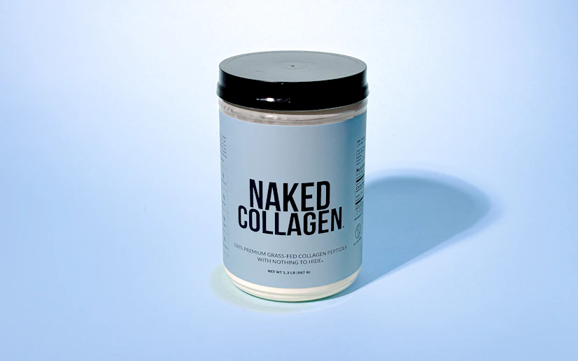 Naked Collagen jar against a blue background