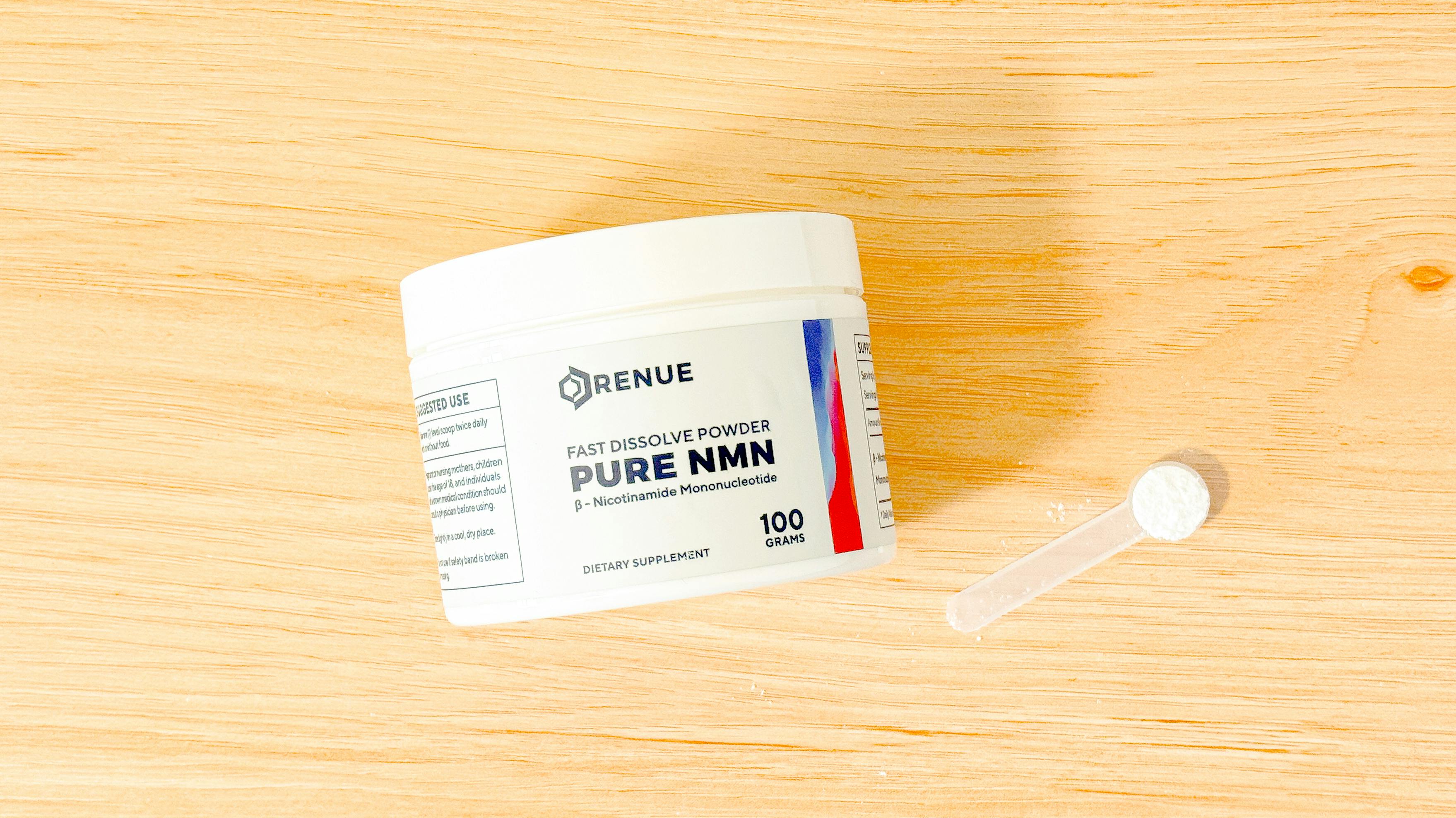 Renue by Science Pure NMN Powder on wood countertop