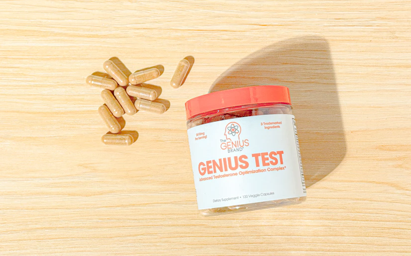 Genius Test bottle and capsules on a wood surface.