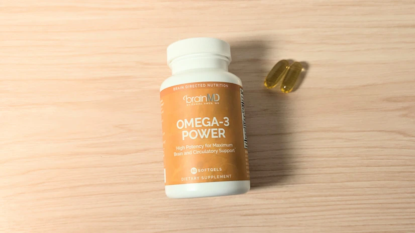 BrainMD Omega-3 Power on a wood surface.