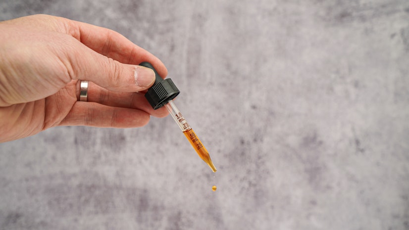 Dropper with a measured dose of Lazarus Naturals Full Spectrum CBD tincture for dogs