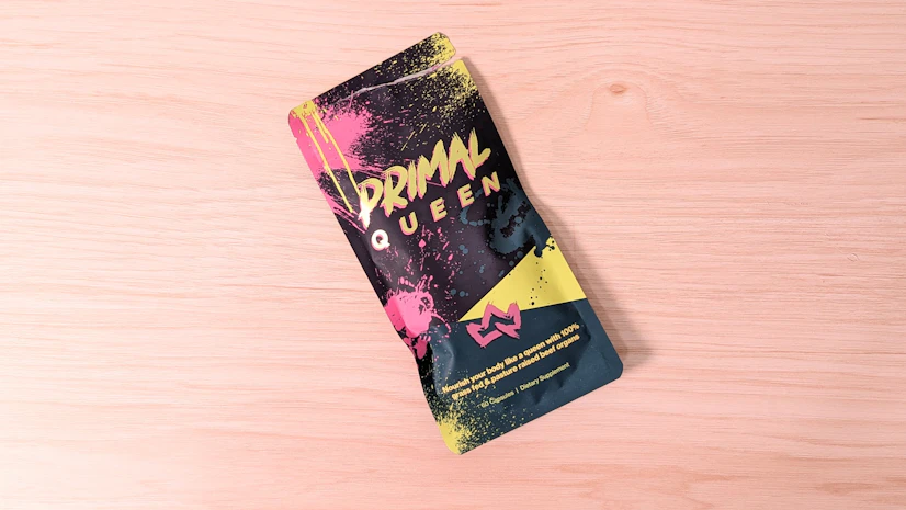 A bag of Primal Queen on a wood surface.