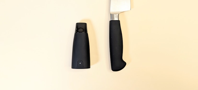 Side-by-side size comparison of Lumen with a kitchen knife handle.